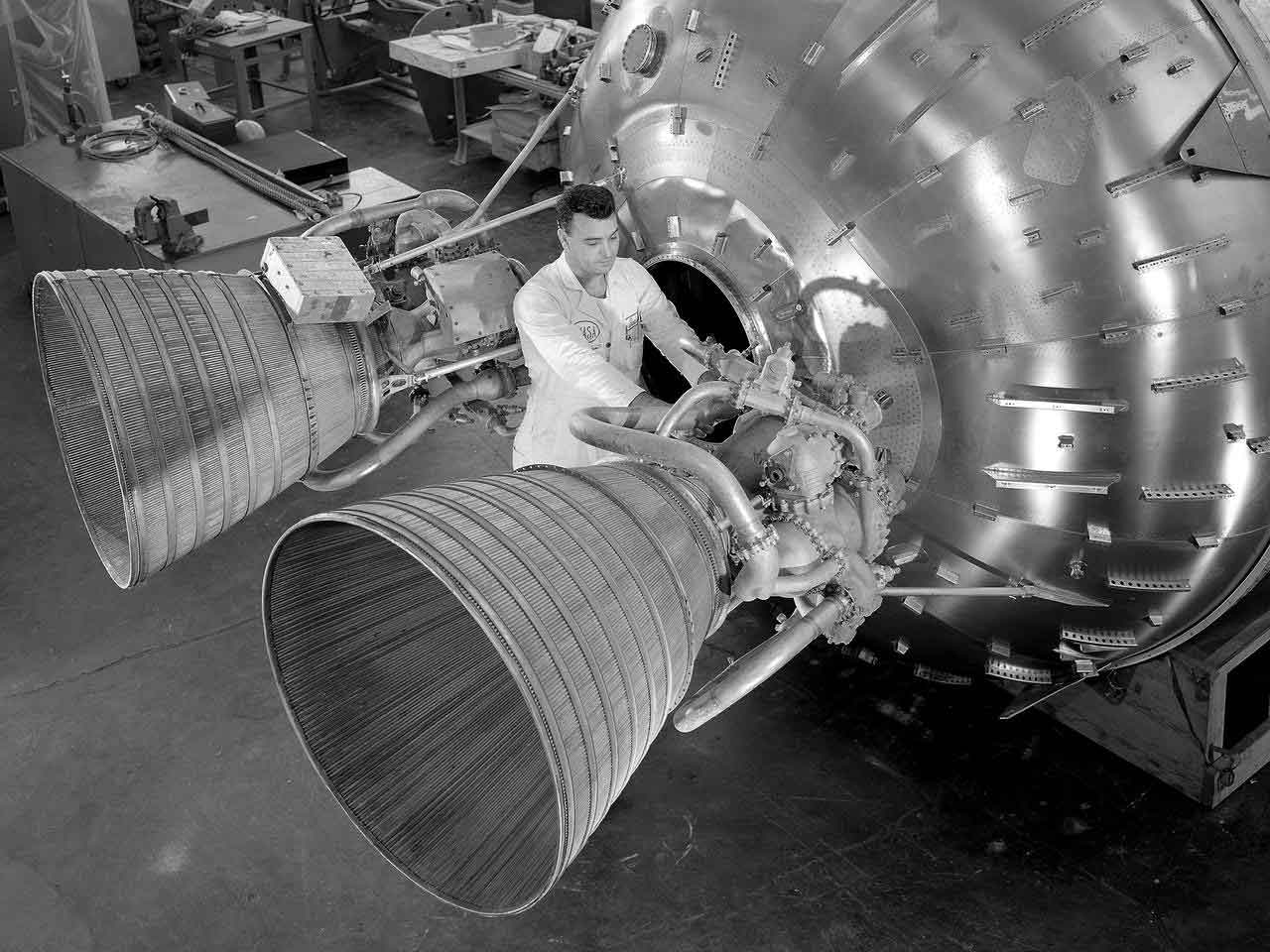 NASA Technician working on rocket booster 1960s