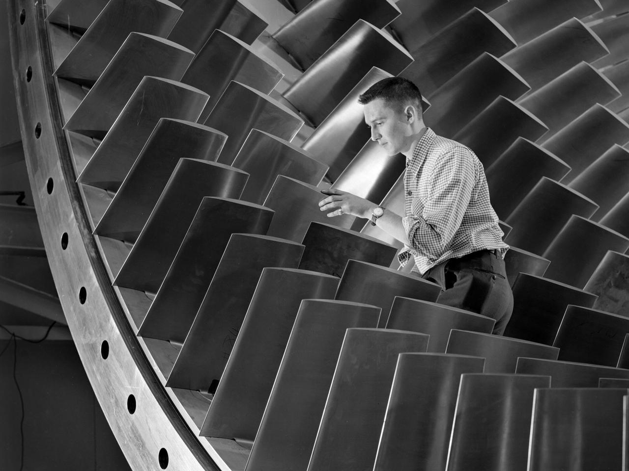 NASA engineer runs quality check on turbine blades 1960s