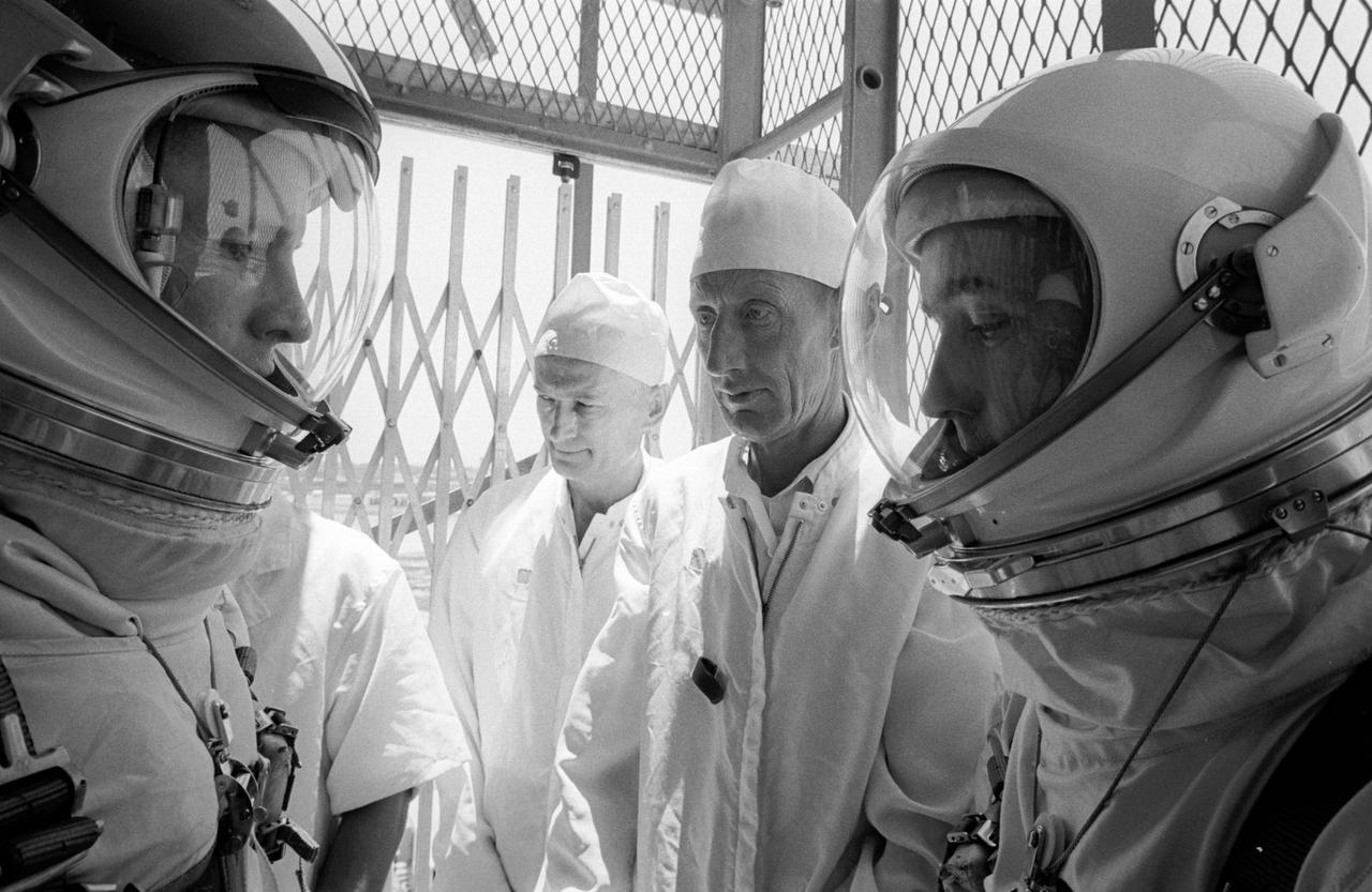 NASA astronauts in elevator to capsule prior to launch 1960s
