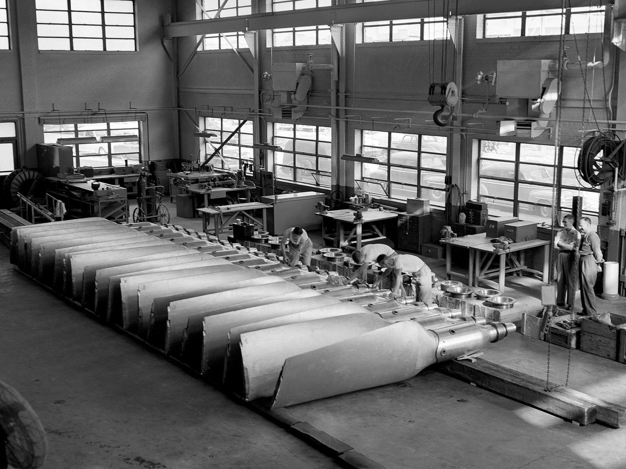 Interior of factory manufacturing rocket parts 1960s