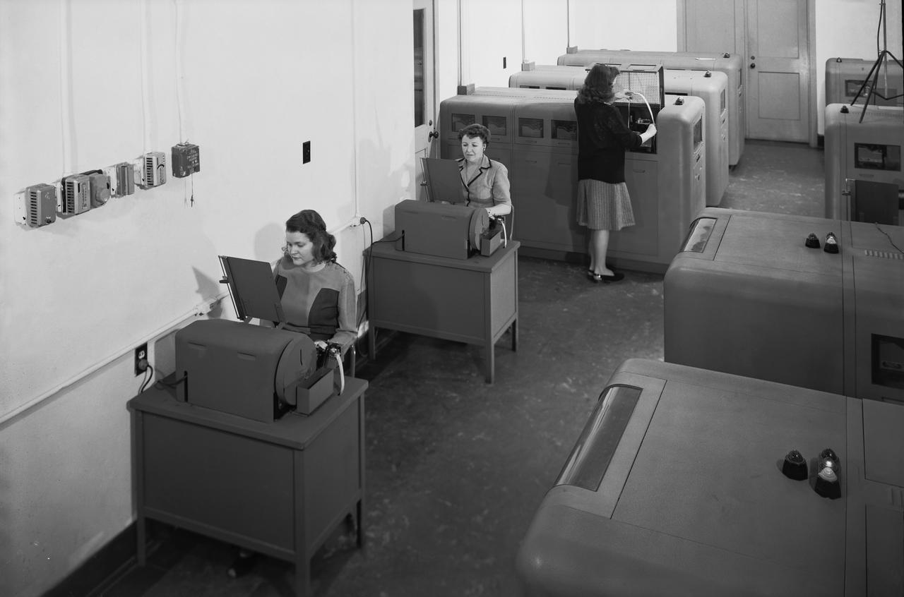 NASA computer room 1940s with ladies using various machines
